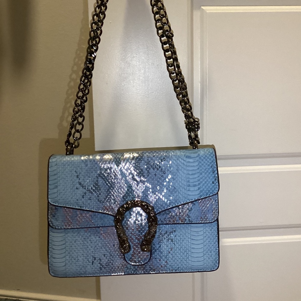 Cute trendy blue snakeskin handbag